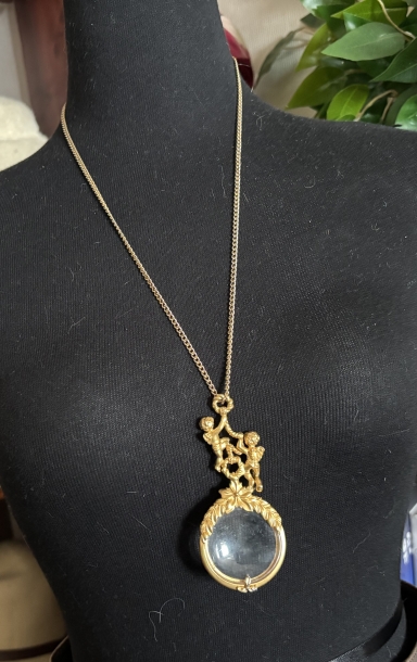a magnifying glass necklace 